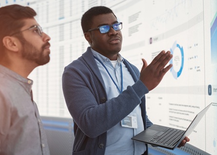 2 guys working on slides