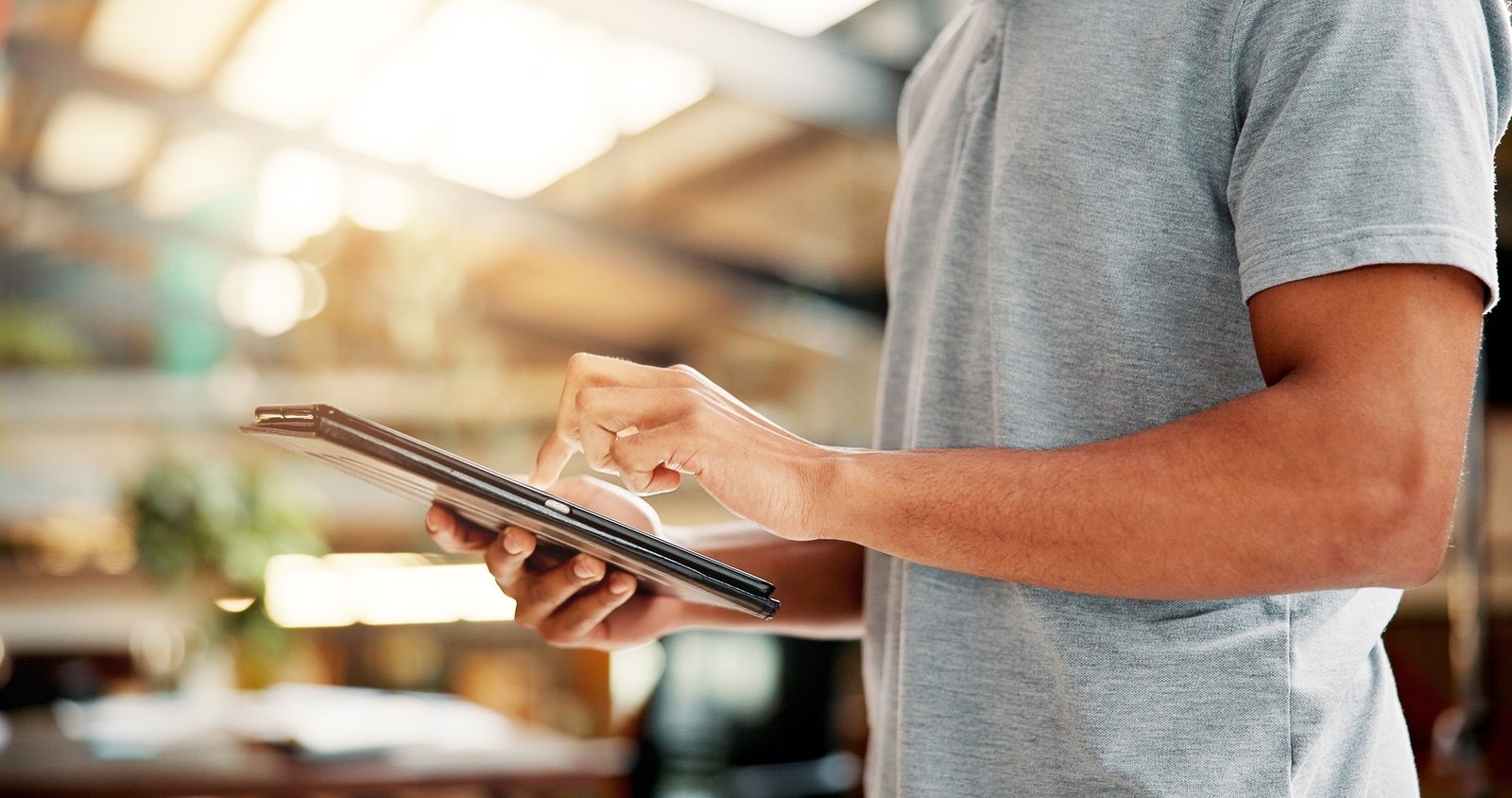 person scrolling on a tablet